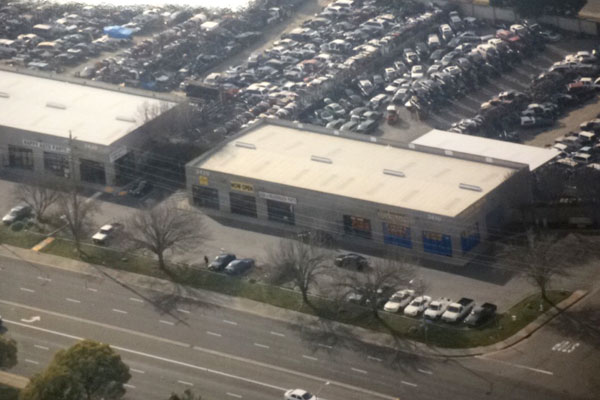 Aerial view of ToyAuto Mart used auto parts store and salvage yard